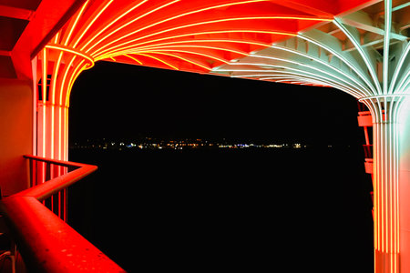 Italy, Rome - November 28, 2023: Panoramic view of port of Civitavecchia from MSC WORLD EUROPA cruise ship. View of Mediterranean coastline at nightのeditorial素材