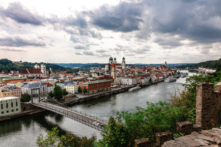 Panoramic view of Passau. Top view of suspension bridge. Aerial skyline of old town with beautiful...