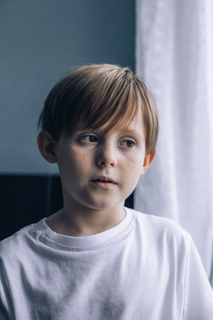Portrait redhead freckled boy, close-up. Expressive facial emotions. Selective focus. High quality photoの写真素材