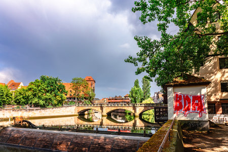 Nuremberg, Germany - July 26, 2023: Colourful historic old town with half-timbered houses of Nuremberg. Bridges over Pegnitz river. Nurnberg, eastern Bavaria, Germany. High quality photoのeditorial素材