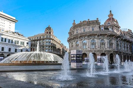 Genoa, Italy - December 3: Main fountain with splashes of water in Ferrari Square against backdrop of beautiful architecture of city. Piazza de Ferrari in Genoa, Liguria, Italyのeditorial素材