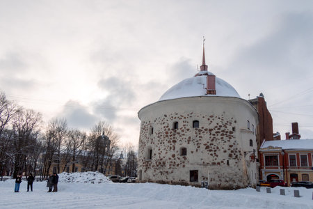 Vyborg, Russia - February 20, 2023: View of Market Square with old Round Tower, Vyborg, Russia
