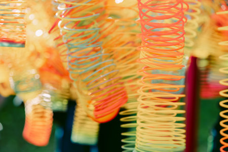 Lots of bright colorful spirals. Abstract blurred background with selective focus on waves.の写真素材