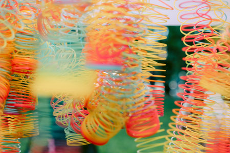 Lots of bright colorful spirals. Abstract blurred background with selective focus on waves. High quality photoの写真素材