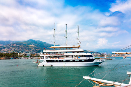 Tourist ships at sea on coast of Alanya. Landscape view of Mediterranean coast, Alanya, Turkey