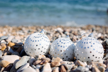 Christmas decorations on beach sea background. Concept of New Years holidays in exotic countries. Selective focus. High quality photoの写真素材
