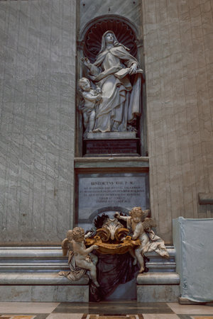 Beautiful architectural interiors in St. Peter Basilica in Vatican. Designed by Donato Bramante, Michelangelo, Carlo Maderno, Gian Lorenzo Bernini. Vertical photoの写真素材