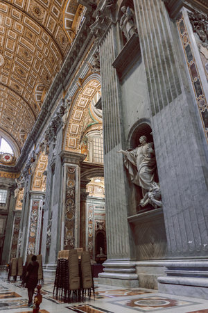 Vatican, Vatican City - December 7, 2023: Beautiful architectural interiors in St. Peter Basilica in Vatican. Designed by Donato Bramante, Michelangelo, Carlo Maderno, Gian Lorenzo Bernini. Verticalの写真素材