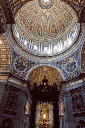 Beautiful architectural interiors in St. Peter Basilica in Vatican. Designed by Donato Bramante, Michelangelo, Carlo Maderno, Gian Lorenzo Bernini. Vertical photoの写真素材
