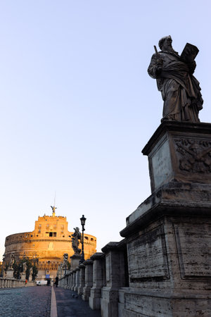 Rome in morning. Panoramic view of Castel SantAngelo and Bridge in Rome with sculptures statues on...
