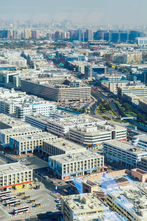 Dubai, UAE - December 10, 2024: Panoramic view of city with towering, streets, car traffic and high rises skyscrapers, Dubai, UAE, Vertical photoのeditorial素材