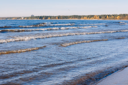 Clear blue water in ocean splashes on coastline. High quality photo