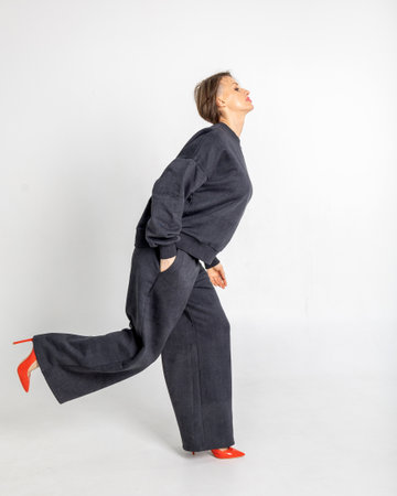 Portrait of a woman posing in studio. Vertical photo. High quality photoの写真素材