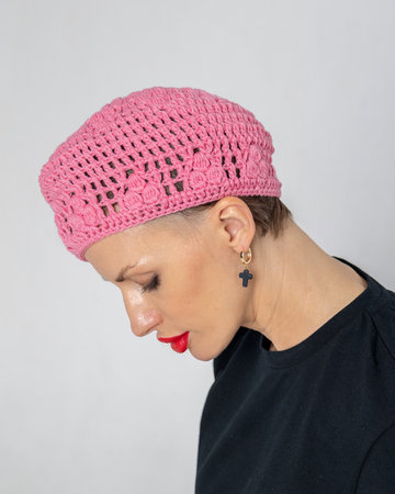 Portrait of beautiful woman in pink beret and black T-shirt in French style. Bright makeup with red lipstick. Vertical photo. High quality photoの写真素材