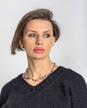 Portrait of young woman close-up on grey background. Studio photography. Vertical photo. High quality illustrationの写真素材