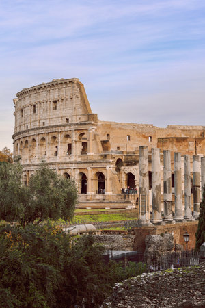 Panoramic view of old Colosseum in Rome. Beautiful popular of ancient landmark. Famous card of city of Rome, Italy. Vertical photoの写真素材