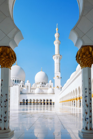 View of Sheikh Zayed Grand Mosque in Abu Dhabi made of white marble with flowers made of precious stones in design and beautiful reflections. Vertical photoの写真素材