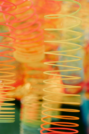 Lots of bright colorful spirals. Abstract blurred background with selective focus on waves. High...