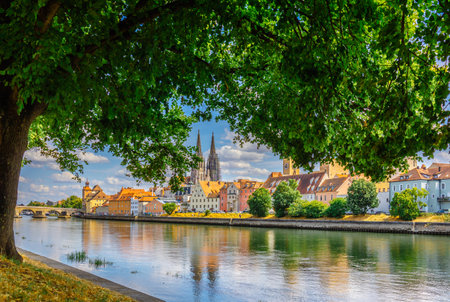Panoramic view on beautiful Stone Bridge, Cathedral and Old Town. River Danube with colorful reflection, Regensburg, Bavaria, Germany. High quality photoの写真素材