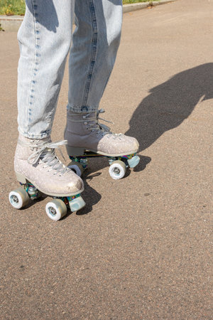 Close-up of legs in quad rollerblades. Vertical photo. High quality photoの写真素材
