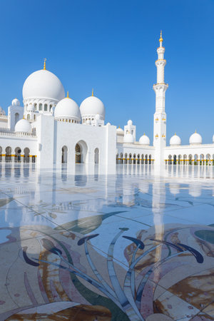 View of Sheikh Zayed Grand Mosque in Abu Dhabi made of white marble with flowers made of precious...