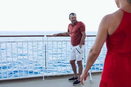 Married couple on cruise ship. Attractive couple on deck with cruise ship. High quality photoの写真素材