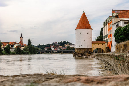 Panoramic view Schaibling Tower and promenade on river Inn, Passau, Lower Bavaria, Germany.の写真素材