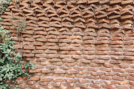 Wall of old red bricks with unusual masonry in Rome, Italy. High quality photo