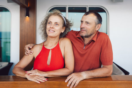 Married couple on cruise ship. Attractive couple on deck with cruise ship. High quality photoの写真素材