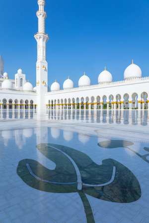 View of Sheikh Zayed Grand Mosque in Abu Dhabi made of white marble with flowers made of precious...