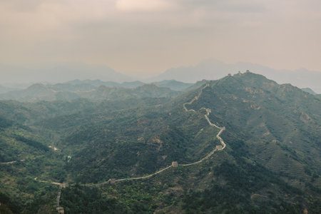 Aerial view of Simatai section of Great Wall of China in its original, un-restored state. Watchtowers perched on mountain peaks, Beijing, China. High quality photoの写真素材