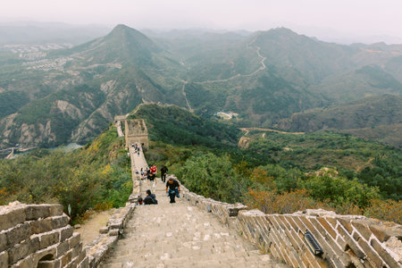 Aerial view of Simatai section of Great Wall of China in its original, un-restored state. Watchtowers perched on mountain peaks, Beijing, China. High quality photoの写真素材