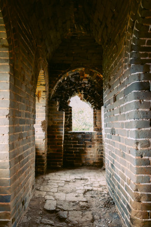 Aerial view of Simatai section of Great Wall of China in its original, un-restored state. Watchtowers perched on mountain peaks, China, Beijing. Vertical photo.の写真素材