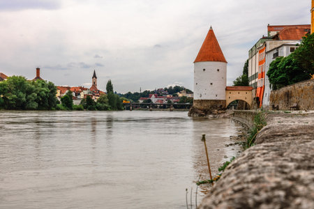Panoramic view Schaibling Tower and promenade on river Inn, Passau, Lower Bavaria, Germany.の写真素材
