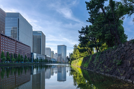 Tokyo, Japan - October 8, 2025: Urban Perspective. Modern office skyscrapers rising behind...