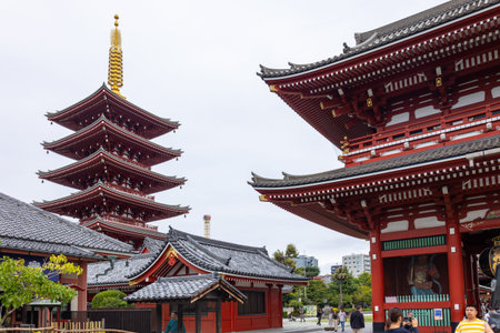 Tokyo, Japan - October 7, 2025: Cultural View. Traditional Japanese temple complex with red pagoda...