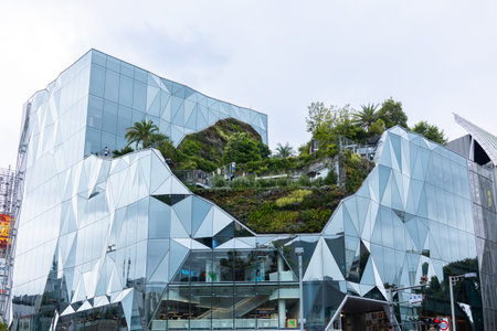 Tokyo, Japan - October 9, 2025: Dior luxury fashion boutique in modern glass building on busy street...