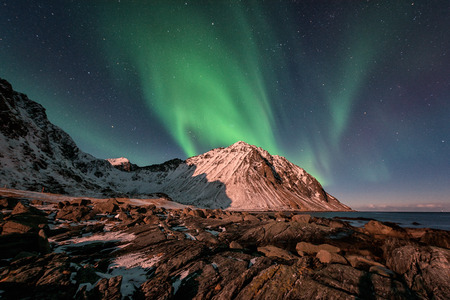 Northern lights, Aurora borealis in Lofoten islands, Norway. Winter landscape with sky starsの写真素材