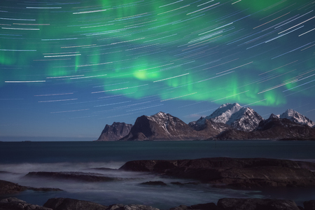 Night winter landscape with Northern lights, Aurora borealis. Scenery view of the Lofoten Islands, Norwayの写真素材