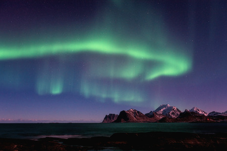 Northern lights, Aurora borealis in Lofoten islands, Norway. Winter landscape with sky starsの写真素材