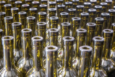 Wine bottles background, winemaking process, preparing wine for bottling in a wineryの写真素材