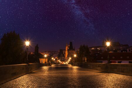 Prague, Charles bridge at night with starry skyの写真素材