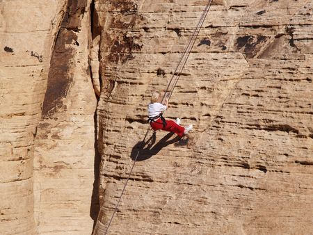 Younster repels down cliff in Red Rock