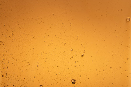close up of flowing melted caramel sauce macroの写真素材