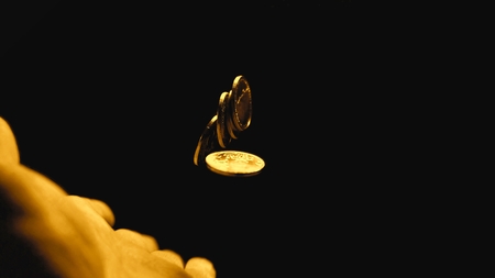 Man holding coins in his handsの写真素材