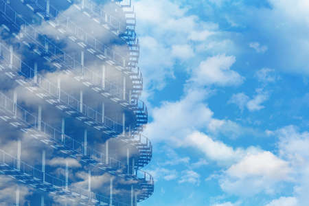 Fragment of concrete metal structures on a background of blue sky with clouds. Construction of a multi-level parking, residential building or commercial property. part of a building under constructionの写真素材