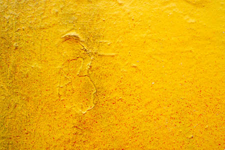 Bright old painted wall with destroyed plaster. Grungy background with cracks, chips and other irregularities. Copy spaceの写真素材