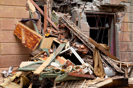 A fragment of an old destroyed brick house. Demolition of dilapidated housing, renovation concept
