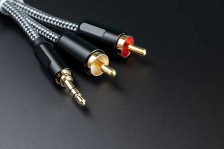 White and red audio connectors on black background. White-red audio connectors on black background....