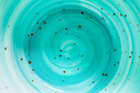 Abstract ceramic background with blue spiral pattern. Watercolor style, view from above. copy space